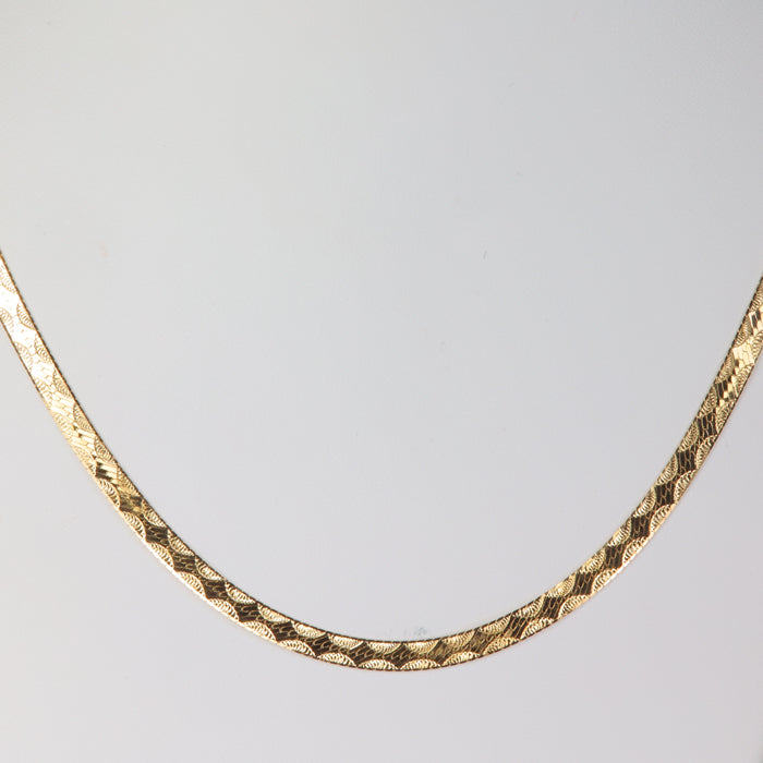 yellow gold herringbone chain with half moon design