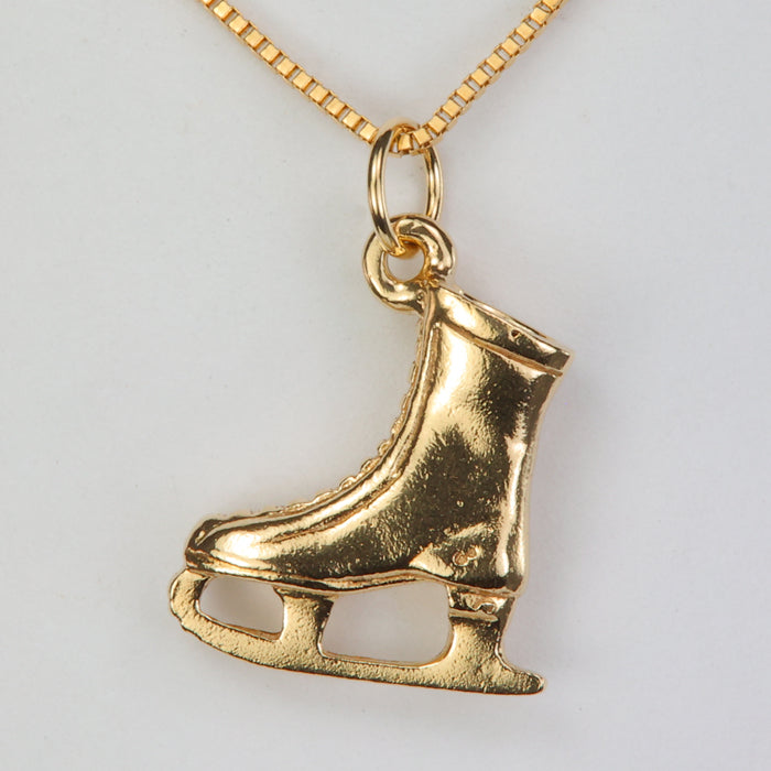yellow gold ice skate pendant
