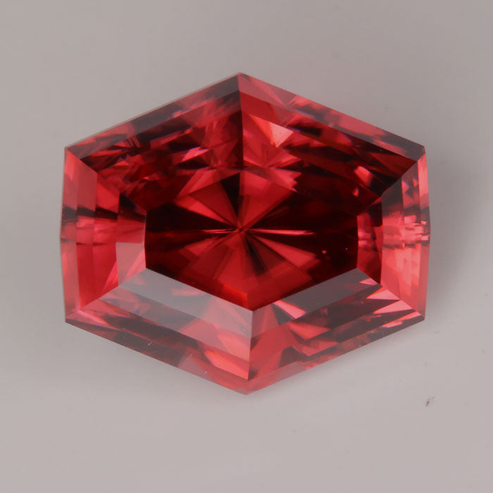 orange red hexagonal brilliant cut imperial zircon gemstone