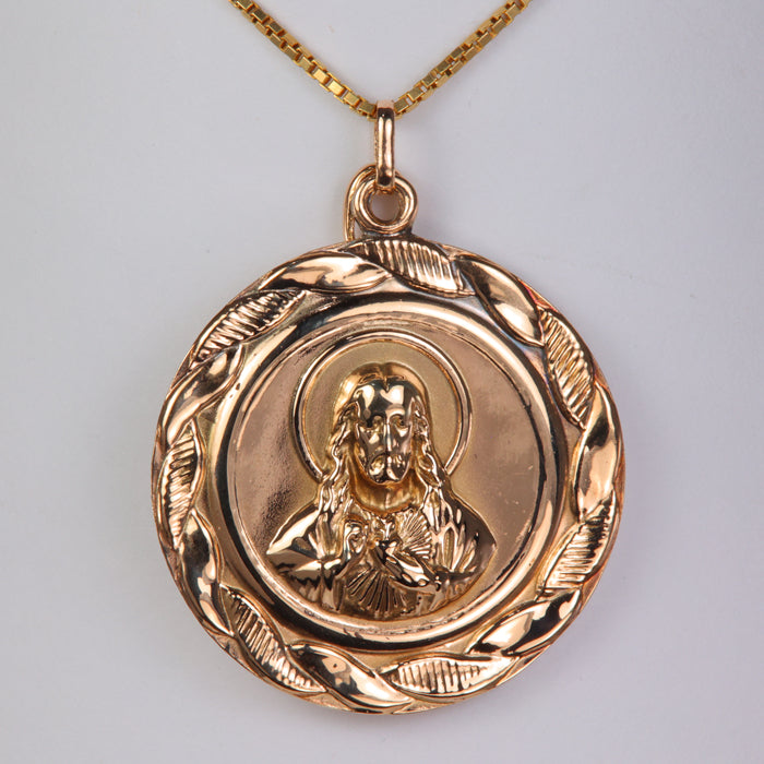 yellow gold double sided Jesus and Mary pendant with horn charm