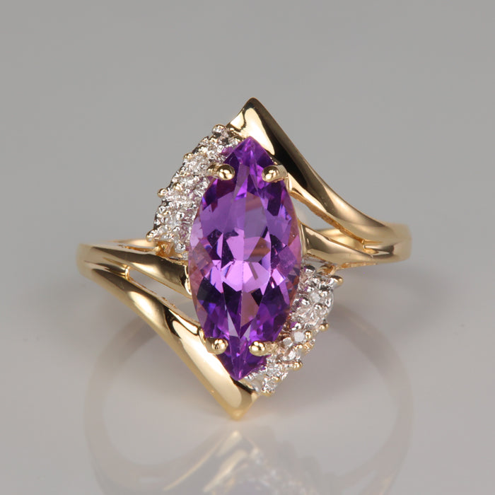 purple color marquise cut amethyst estate ring with diamond accents in yellow gold