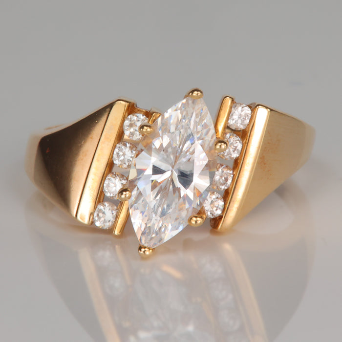 yellow gold estate ring with marquise and round cubic zirconias