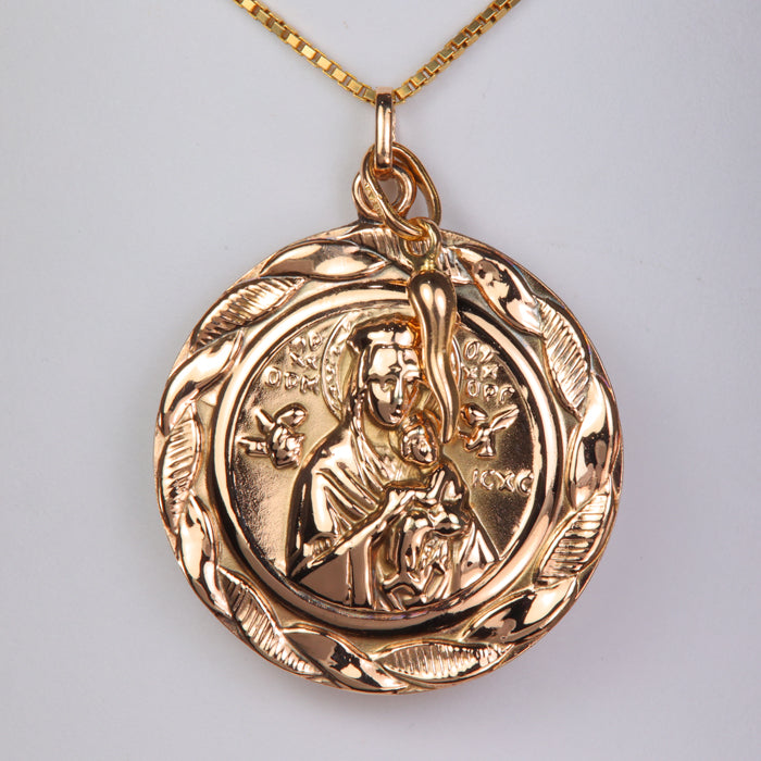 yellow gold double sided Jesus and Mary pendant with horn charm