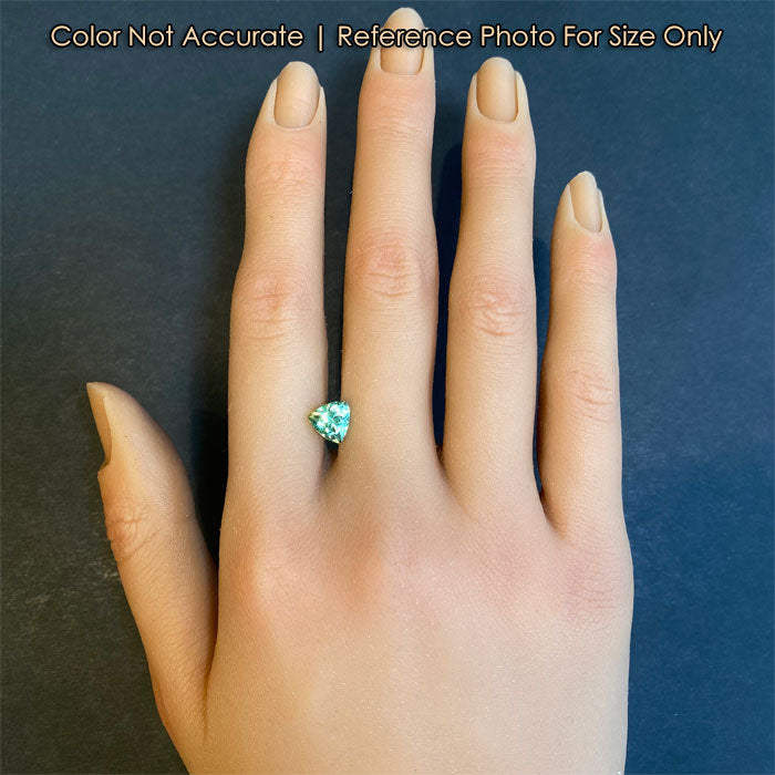 mint garnet trilliant cut on hand
