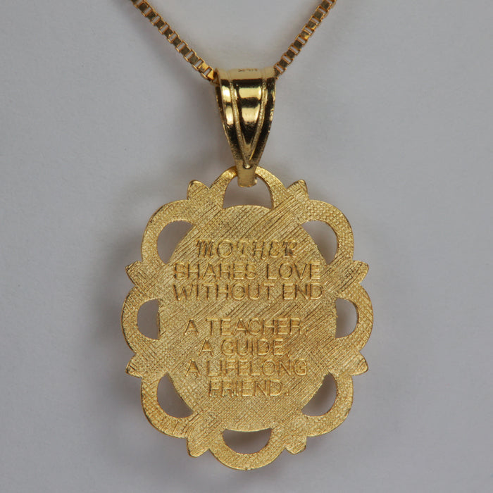mothers love poem on back of yellow gold pendant