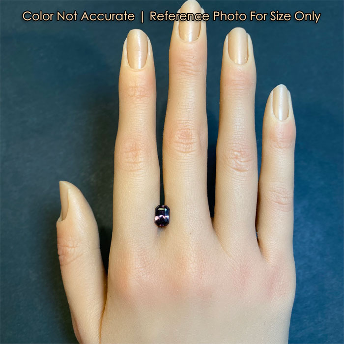 size reference of tanzanite gemstone on hand