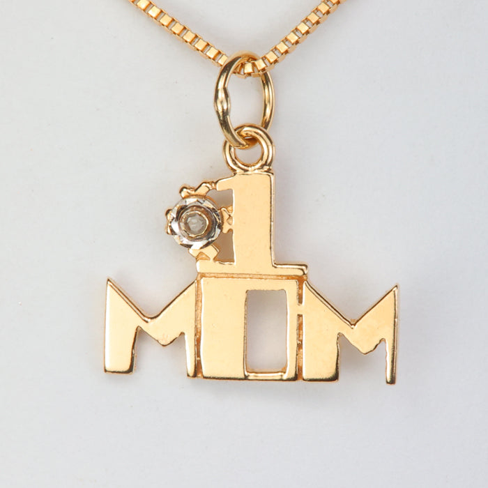yellow gold mom pendant with diamond accent