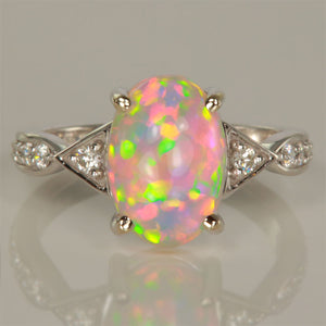 Opal Cabochon Oval Ring with Diamonds in 14k white gold