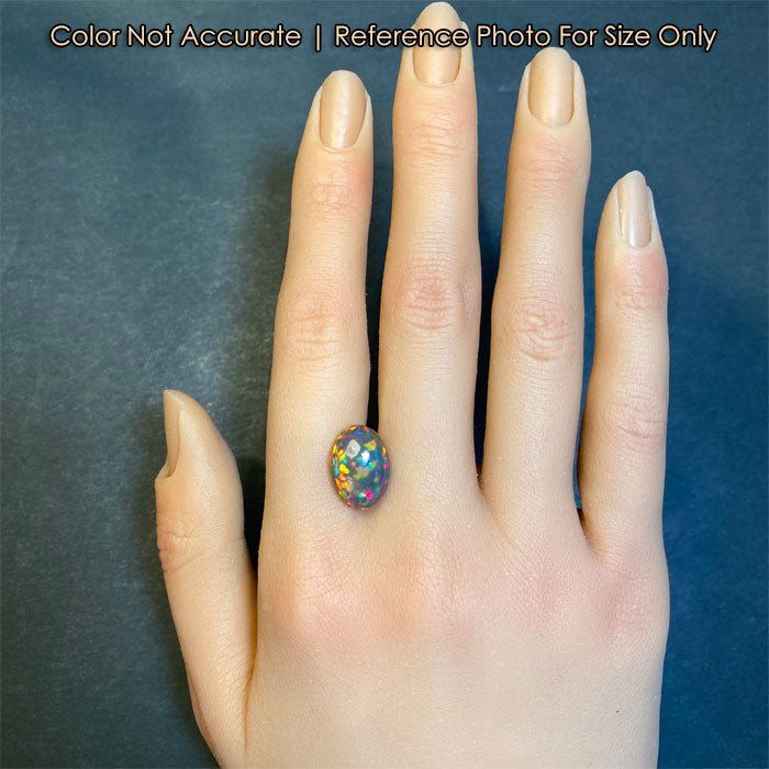 oval cabochon opal on hand