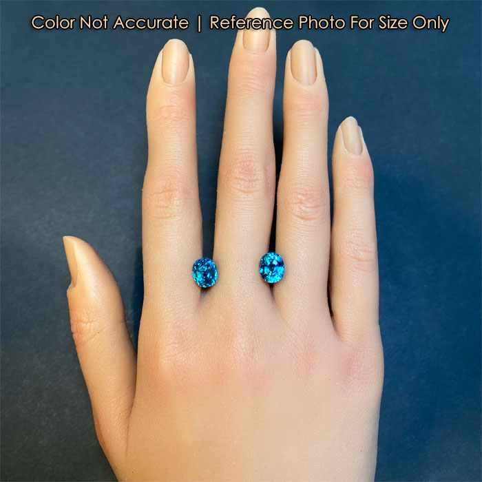 blue zircon mixed oval cut on hand 