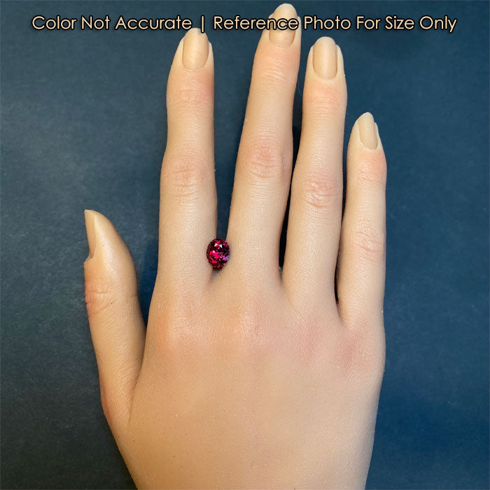 garnet gemstone on hand