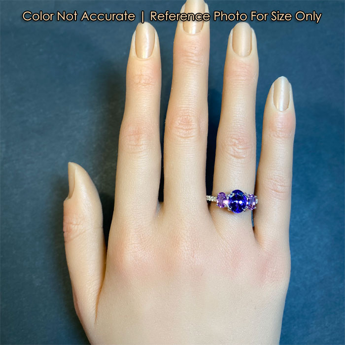 tanzanite and sapphire ring with diamonds on hand