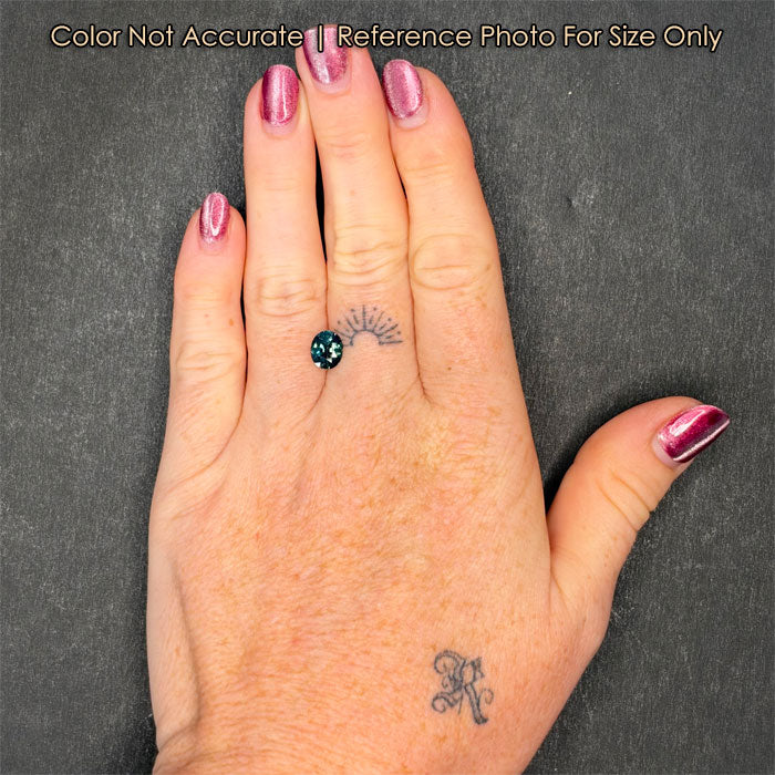 color shift sapphire gem on hand 