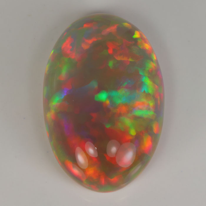 oval cabochon cut opal rainbow colors 