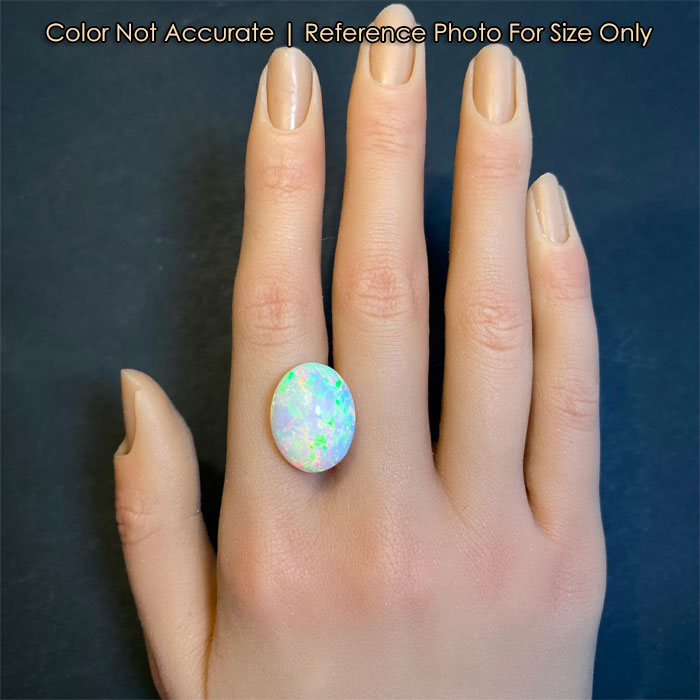 oval opal gemstone on hand 