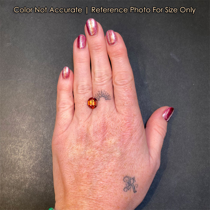 garnet gemstone orange on hand