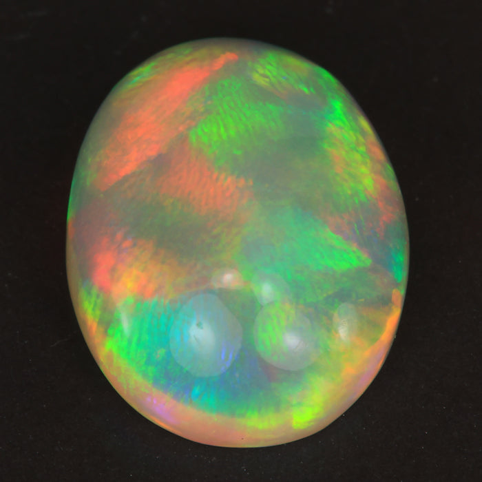 oval cut rainbow color opal gemstone from Ethiopia