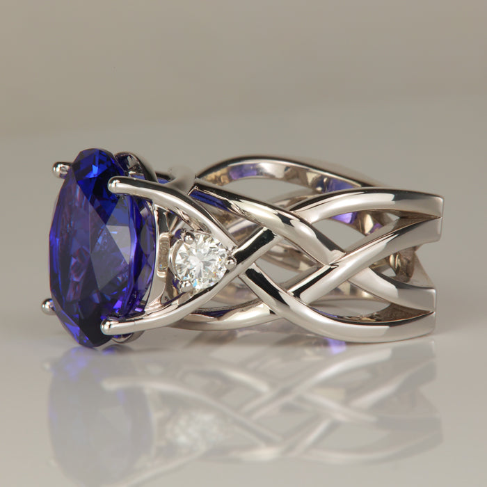 white gold oval tanzanite and diamond ring