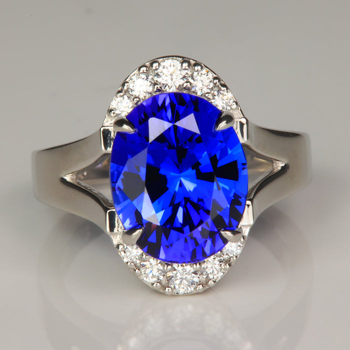 oval tanzanite gemstone ring with diamonds set in platinum