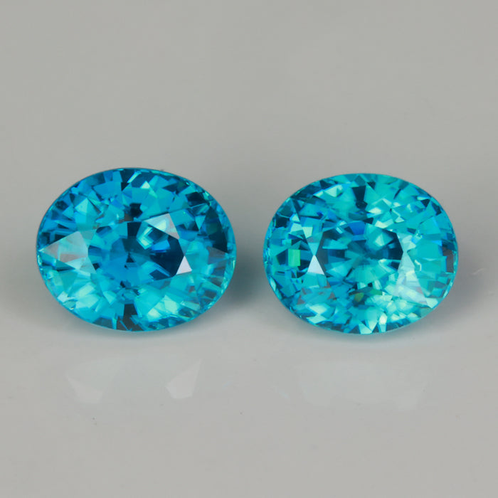greenish blue oval cut blue zircon gemstone pair