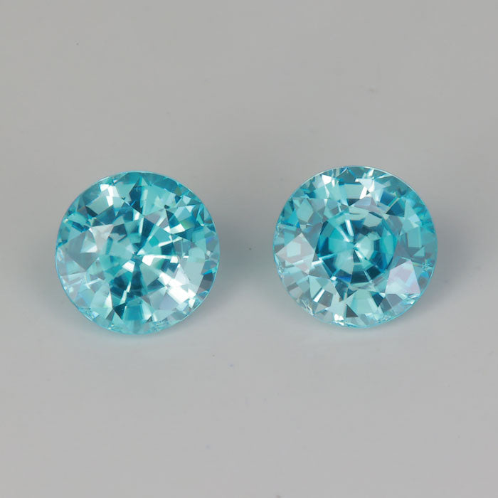 green blue zircon round brilliant cut gems pair