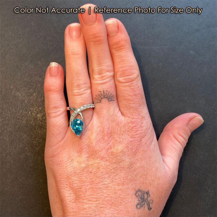 size of pear blue zircon on hand 