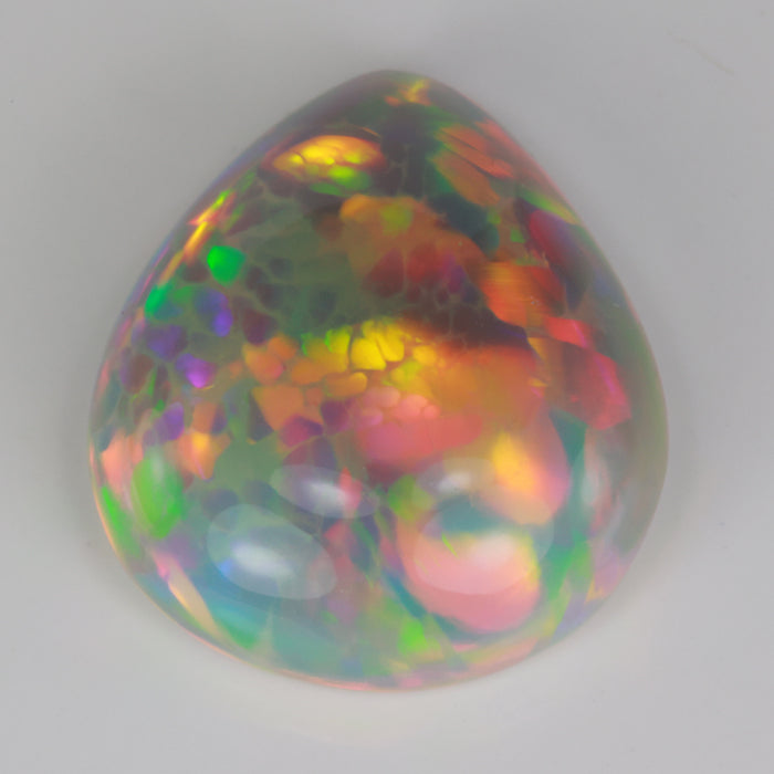 pear shape cabochon cut semi black opal gemstone