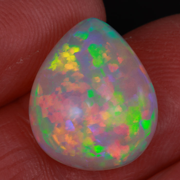 pear shaped opal gemstone in hand