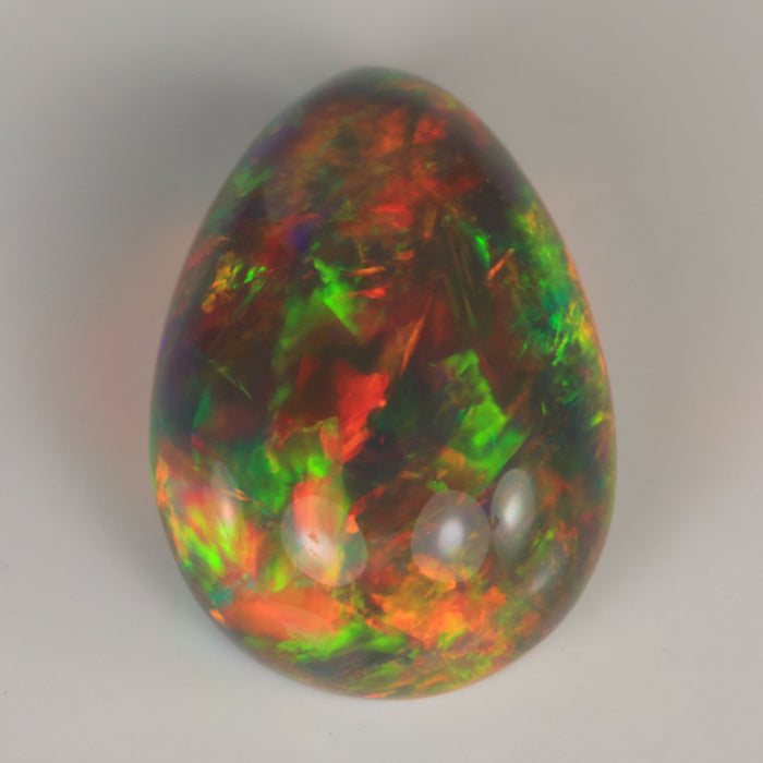 pear shape rainbow color semi black opal gemstone