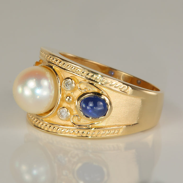yellow gold ring with pearl and sapphire and diamond accents