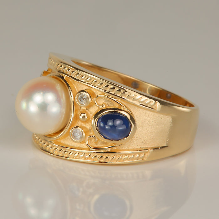 yellow gold ring with pearl and sapphire and diamond accents