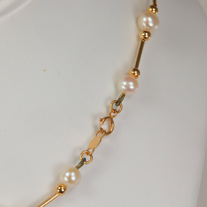 clasp of yellow gold pearl bead and tube necklace