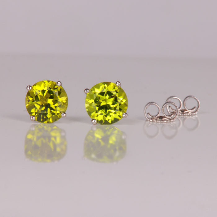 round cut peridot stud earrings white gold
