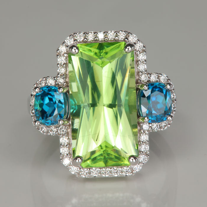 mint green peridot ring with blue zircons and diamonds