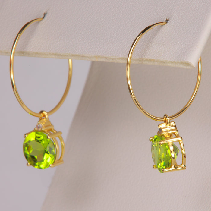 yellow gold hoops with peridot and diamond accents