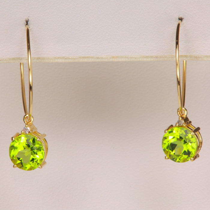 peridot and diamond hoop earrings in yellow gold