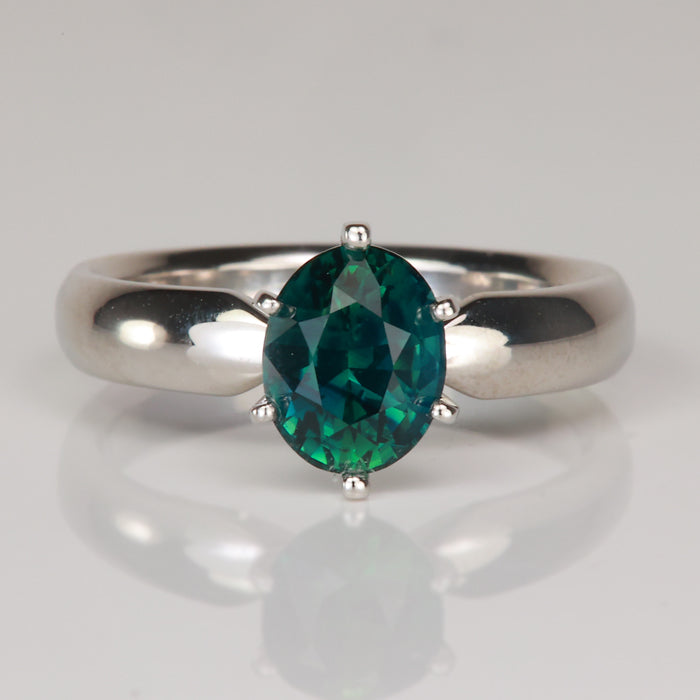 oval cut teal sapphire gemstone ring in platinum