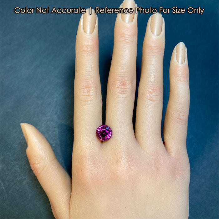 size of round violet red garnet gem on hand