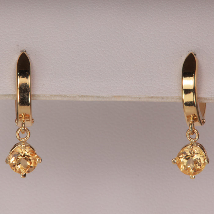 huggie hoop earrings with precious topaz gem