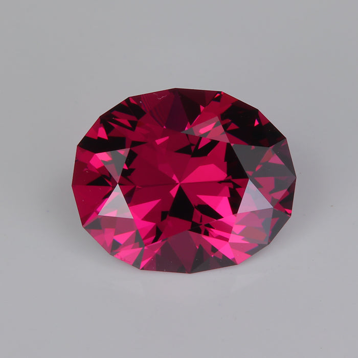 umbalite garnet gemstone oval cut reddish violet