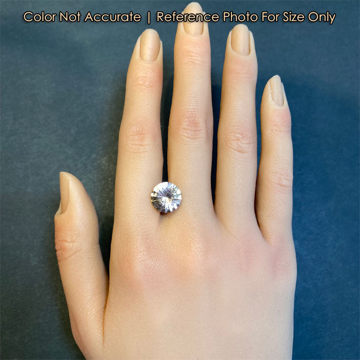 tourmaline gemstone slightly peach on hand