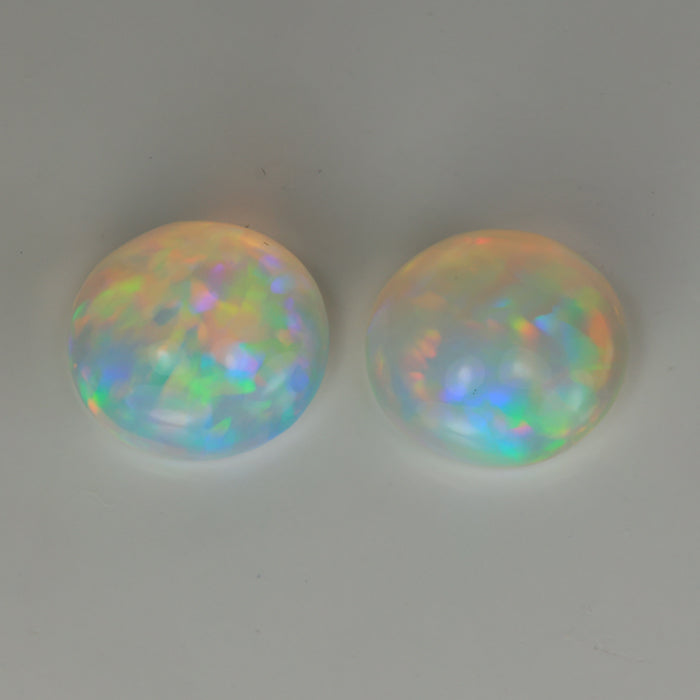 rainbow color round cabochon cut opal gemstone pair 