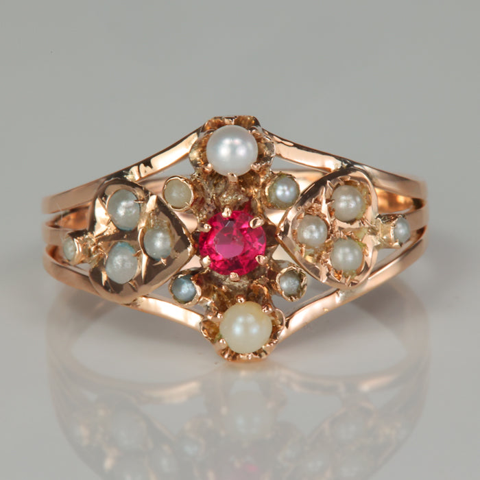 rose gold ring with seed pearls and ruby gemstone