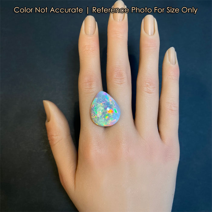 opal gemstone pear shape on hand for size