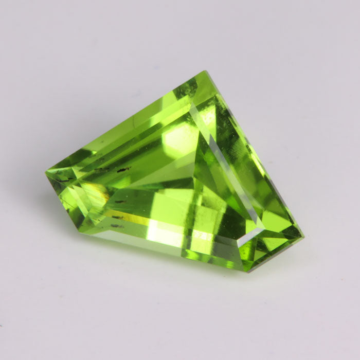 stepped shield cut green pakistan peridot gemstone
