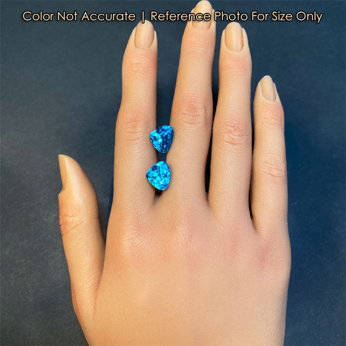 greenish blue zircon gems on hand