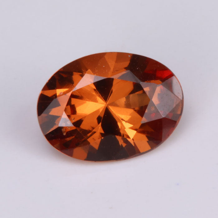 oval cut brownish orange spessartite garnet