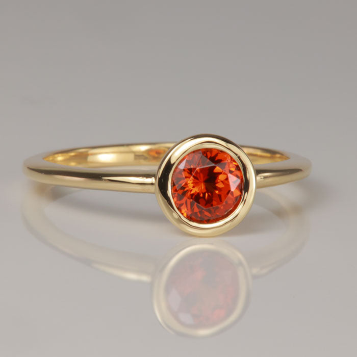 garnet ring spessartite yellow gold bezel set