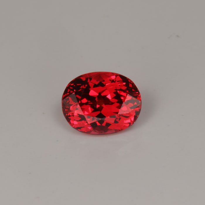 oval cut spinel gemstone orange red