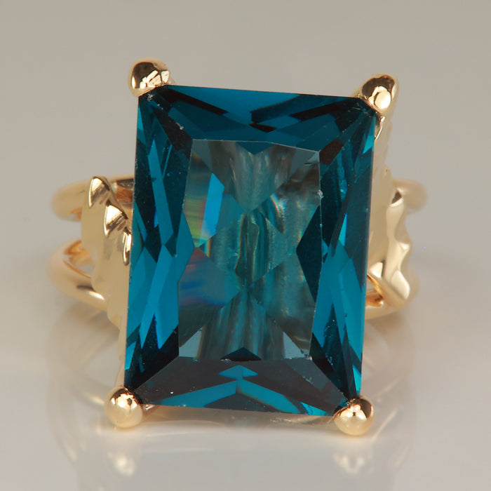 blue green synthetic spinel gemstone ring in yellow gold